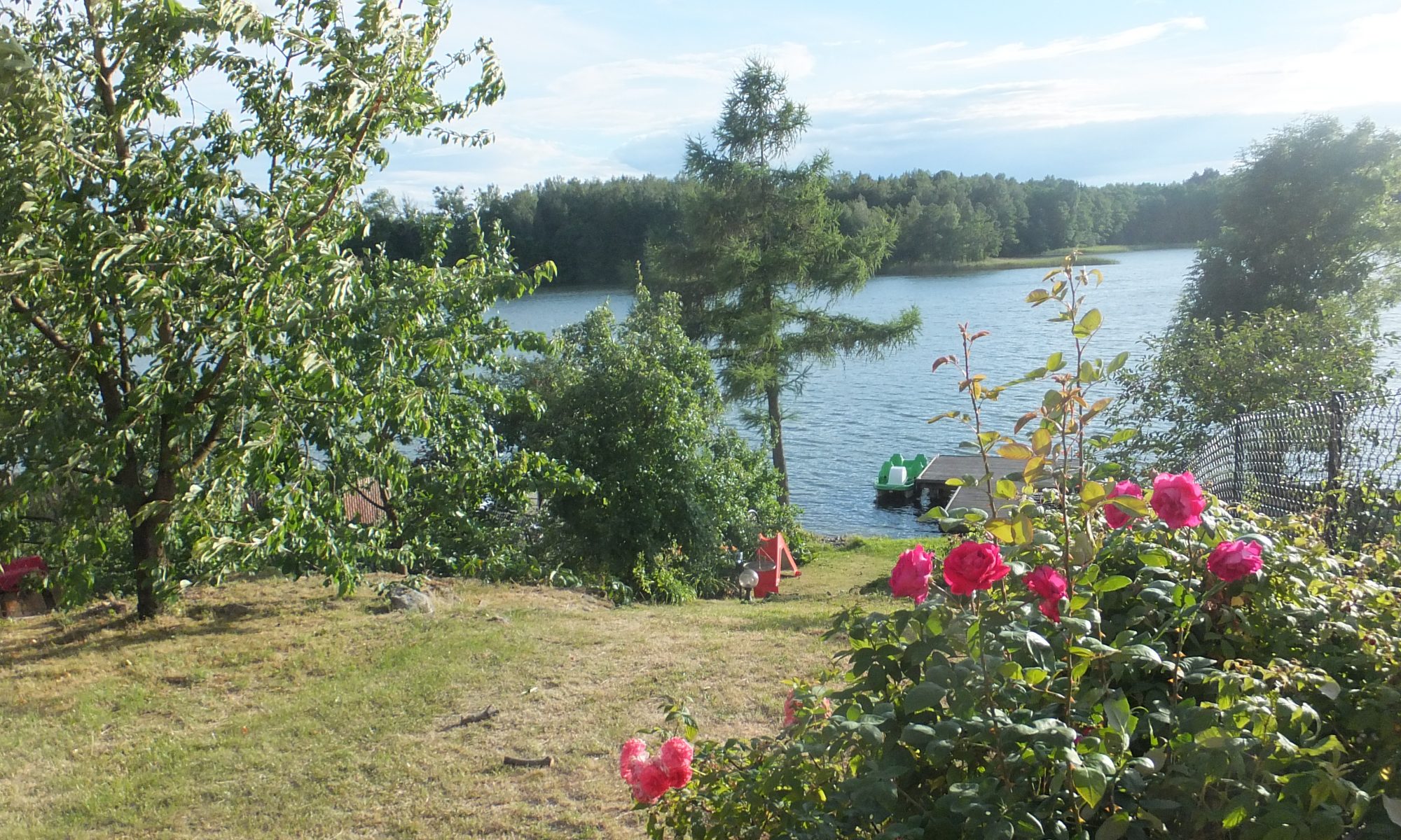 Wodna Przygoda house and grounds by a lake in Masuria